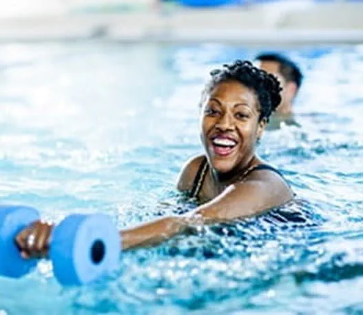 A person exercising in a swimming pool