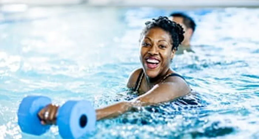 A person exercising in a swimming pool