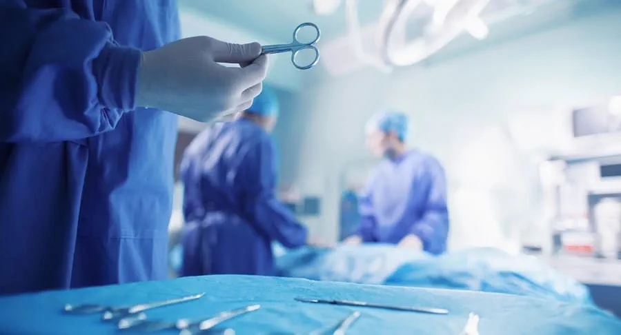 Doctors performing surgery in a hospital operating room