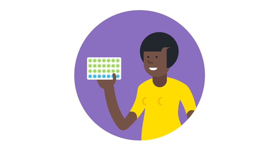 Person holding a pack of birth control pills