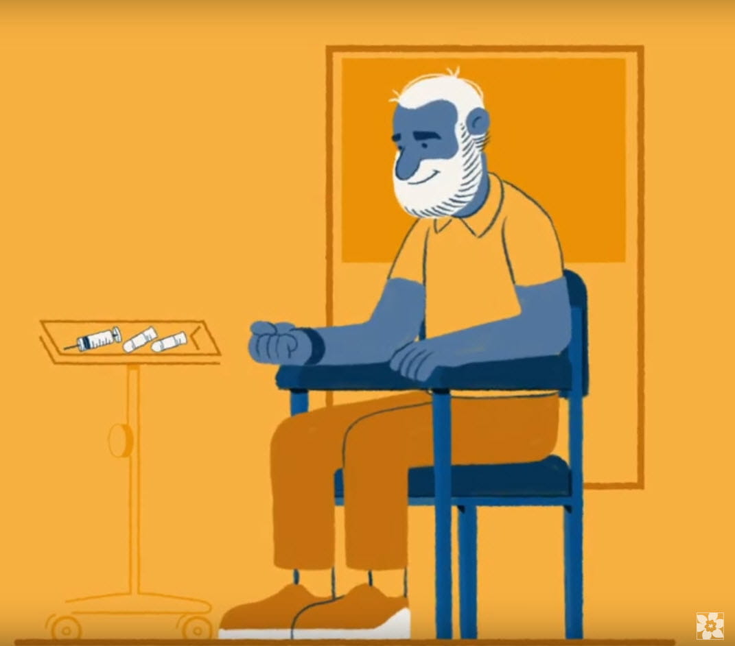 Un homme assis, en attente d’un prélèvement sanguin