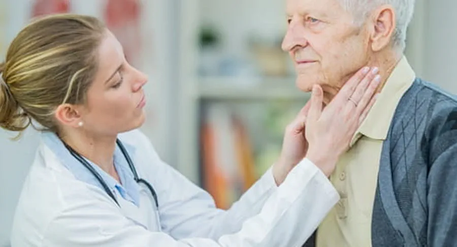 Doctor checking a patients lymph nodes.