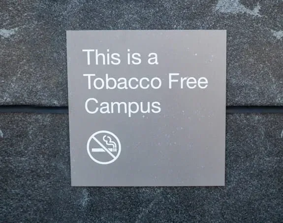 a sign that says This is a Tobacco Free Campus with an image of a cigarette with a line through it