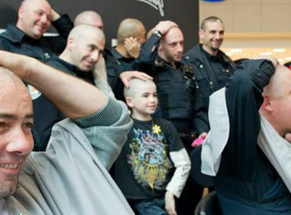 Cops getting their heads shaved.
