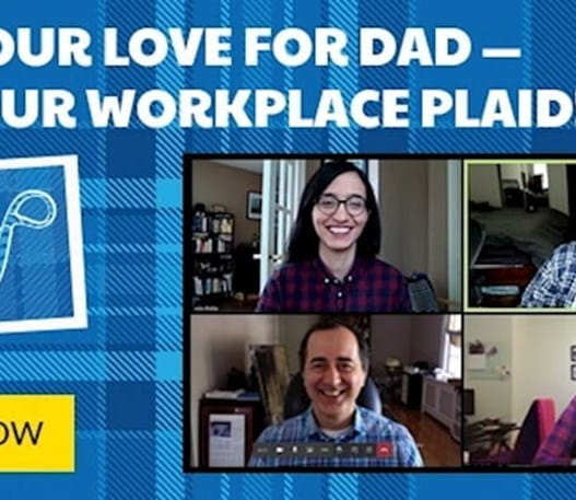 A group of employees wearing plaid t-shirts.