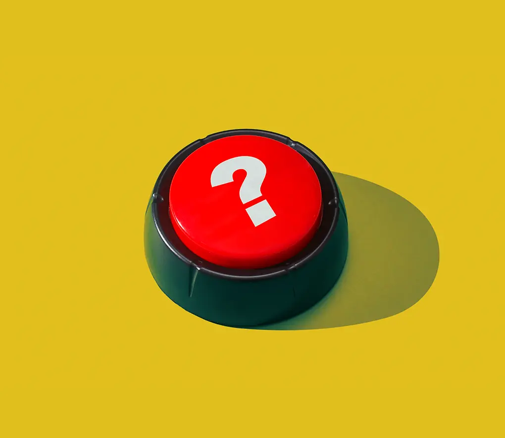 A large buzzer button with a question mark.