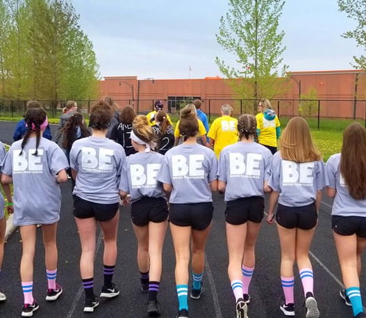 The back of a group of girls wearing Relay For Life t-shirts.