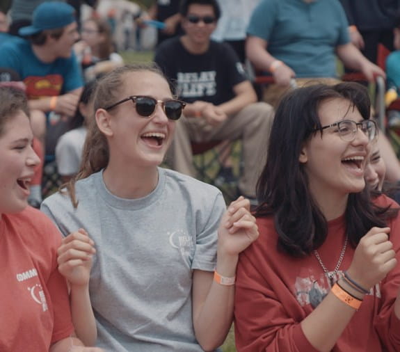 Two young girls laughing at a Relay For Life event.