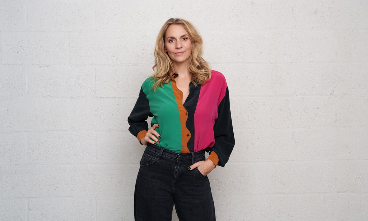 Léane Labrèche-Dor wearing a colourful sweater, in a minimalist setting for CCS’s campaign