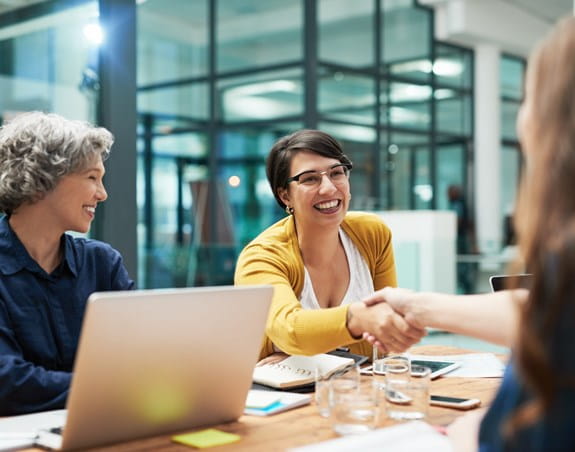 Business women shaking hands