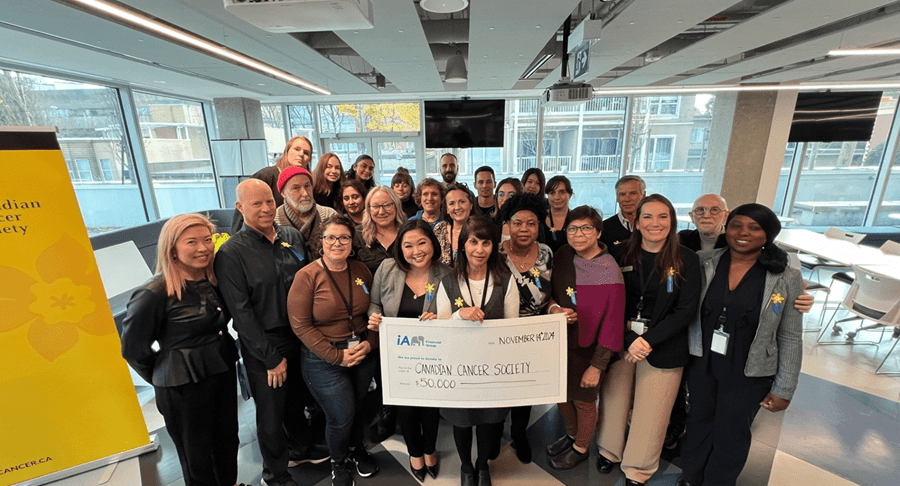 A group of iA Financial and CCS staff members, including Jiwani, at a joint CCS-iA event in Vancouver