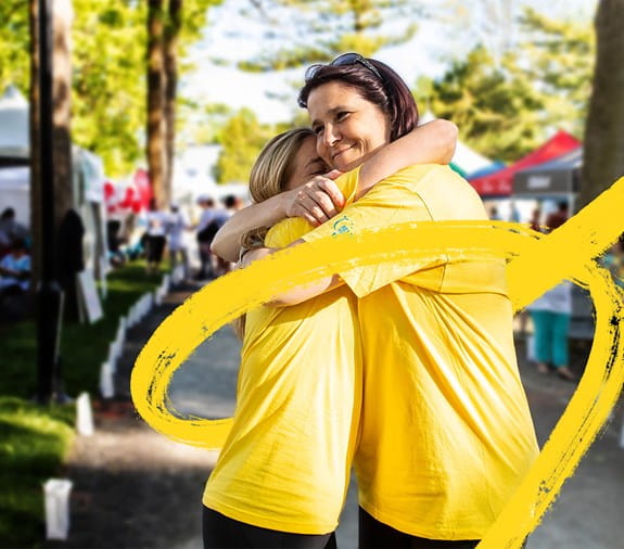 Two women hugging at Relay