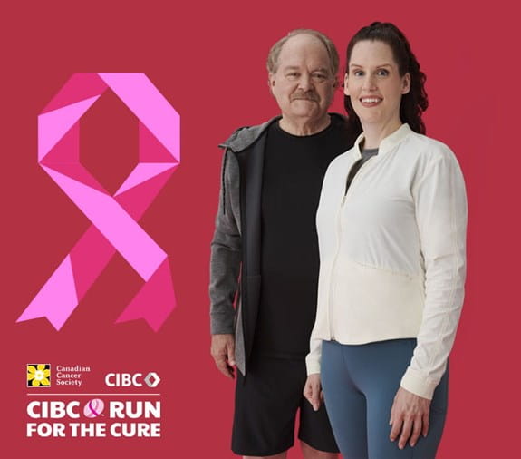 Morgan, a breast cancer survivor is standing next to her father Len, and they are smiling at the camera.