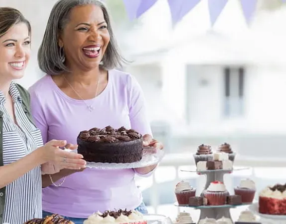 Two women at a bake sale