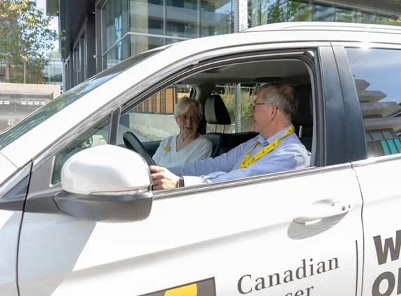 A picture of a wheels of hope driver and passenger