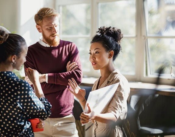 A man and three women brainstorm ideas.