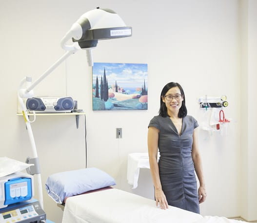 A photo of Dr May Lynn Quan smiling at the camera