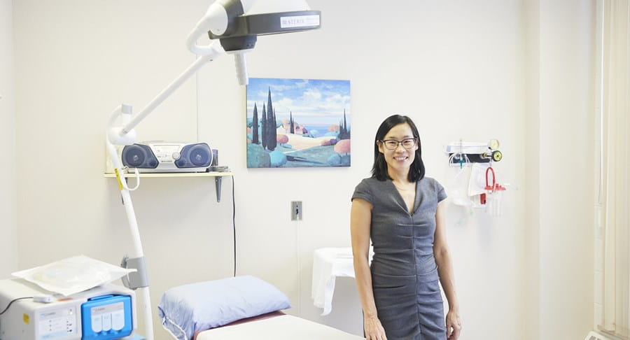 A photo of Dr May Lynn Quan smiling at the camera