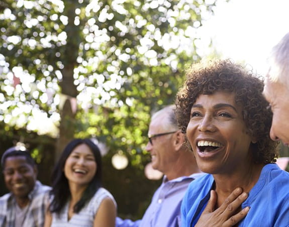 A group of people laughing together 