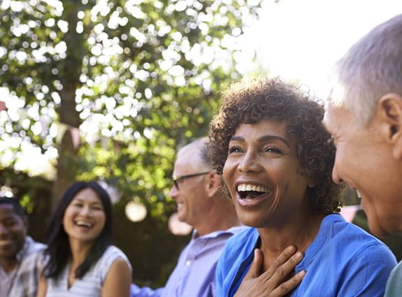 A group of people laughing together 