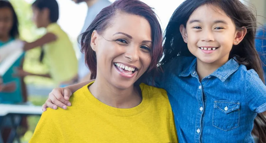 Women with a young girl smiling