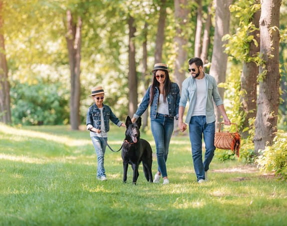 Family with sunglasses and a dog