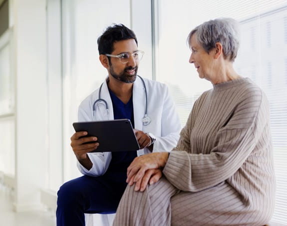 A woman talking to her doctor