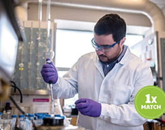 A cancer researcher works in a lab.