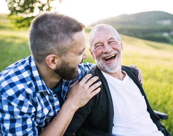 A man and his grandfather share a laugh.