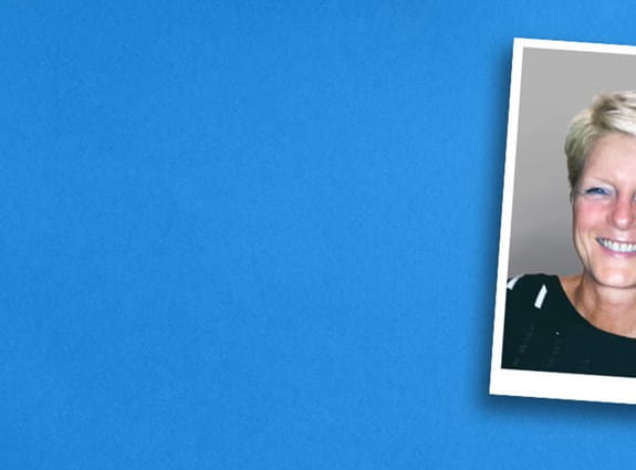 A picture of a man and his wife on a blue background banner.
