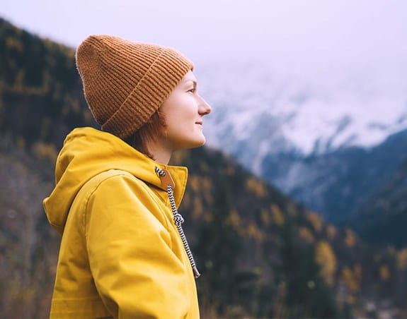 Woman looks out over landscape