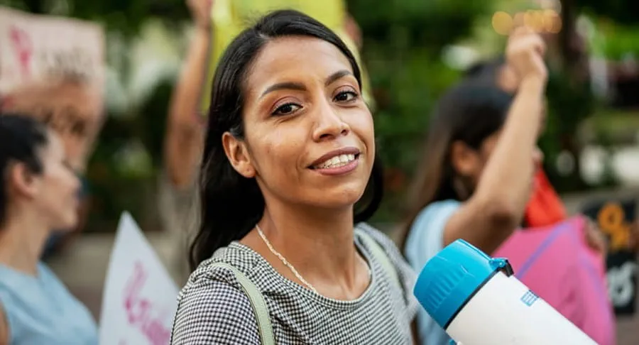 Women in a crowd on a megaphone