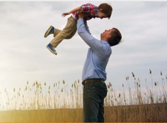 Father holding son up in the air